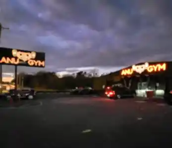 Anu Gym at Night Storefront signage in charlotte