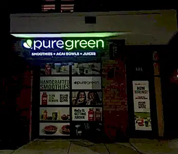PureGreen at Night Storefront signage in charlotte