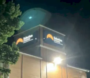 Illuminated storefront signage for hotel